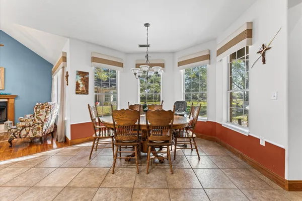 a view of a dining room with furniture window and outside view