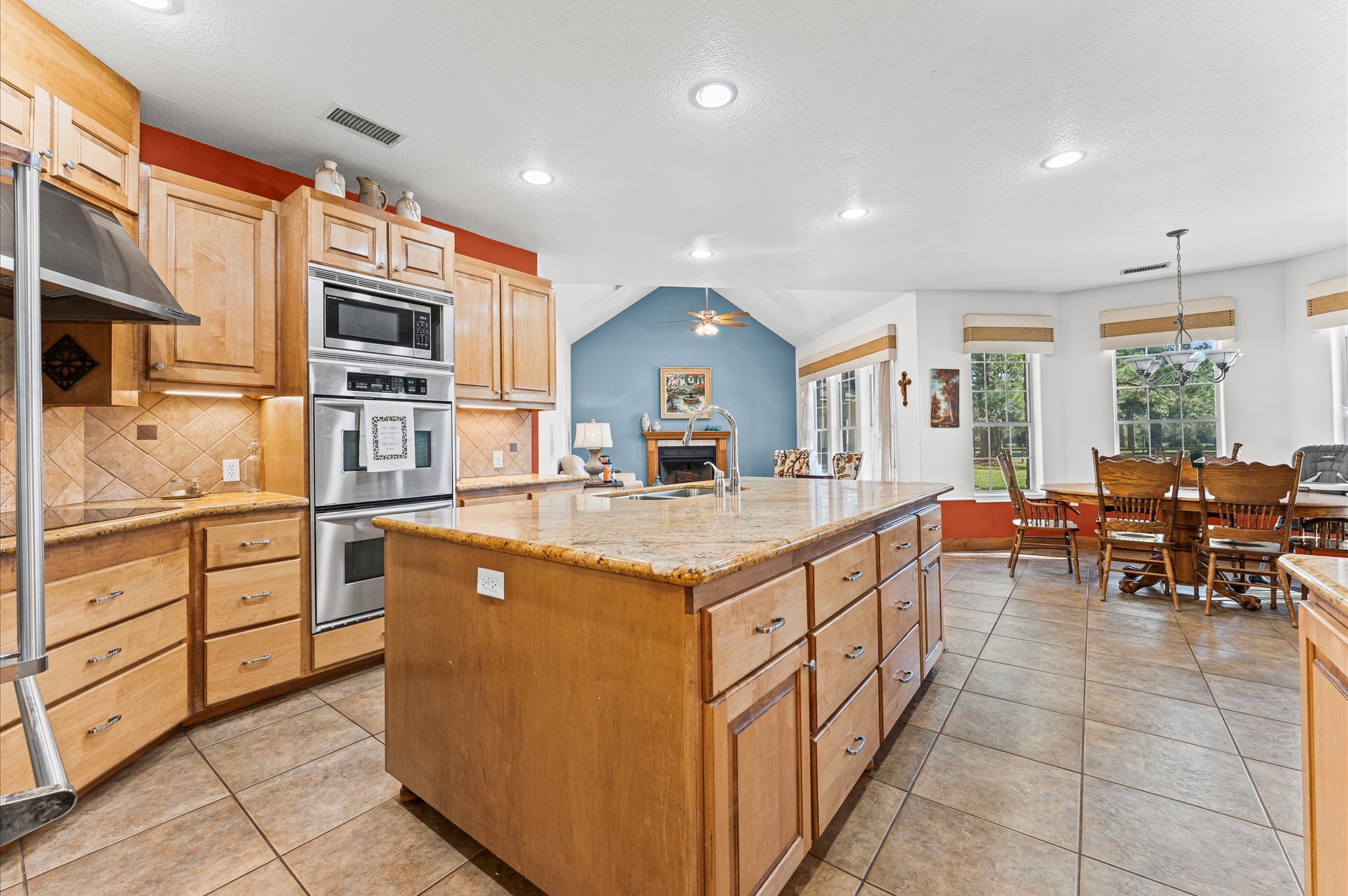 21550-21554 Mueschke Road Tomball, TX 77377 - Photo 9 of 42 a kitchen with stainless steel appliances granite countertop a sink and cabinets