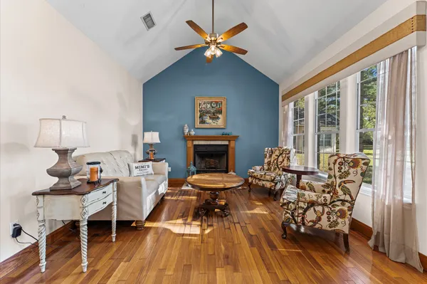 a living room with furniture and a fireplace