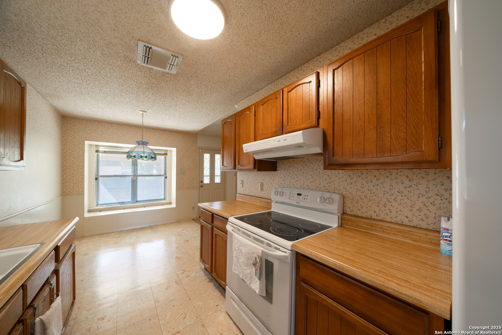 1514 Lochshire Street San Antonio, TX 78216 - Photo 11 of 30 a kitchen that has a sink and a stove
