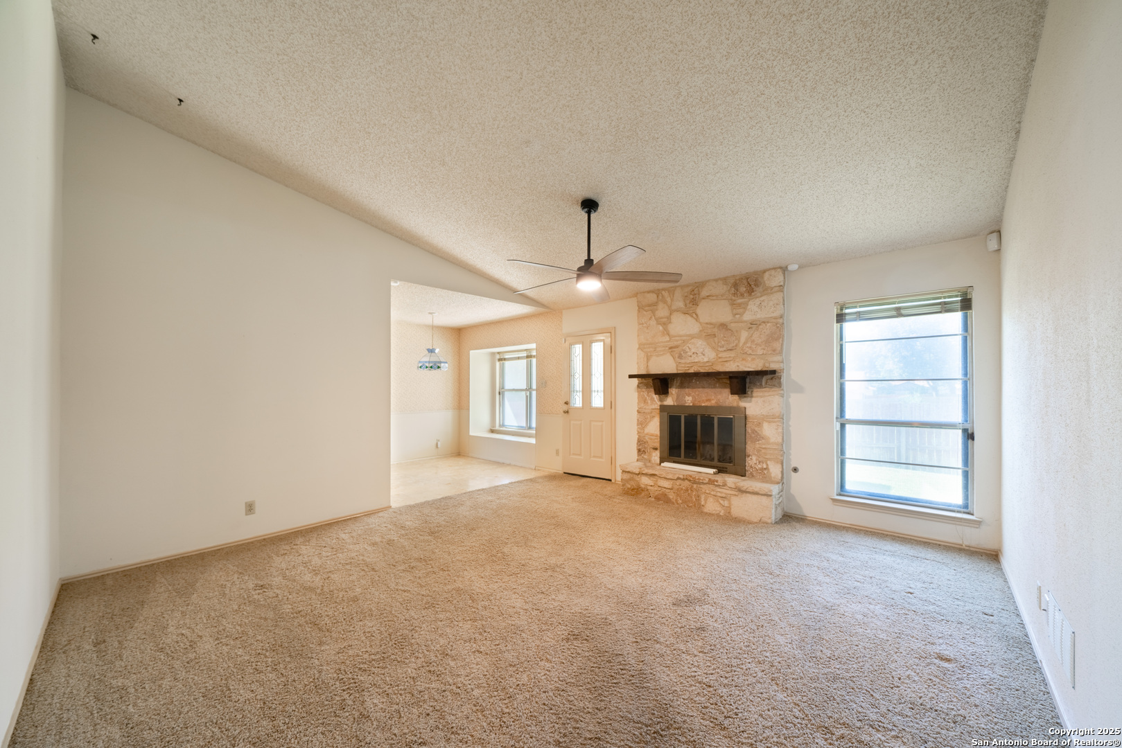 1514 Lochshire Street San Antonio, TX 78216 - Photo 15 of 30 an empty room with fireplace and windows
