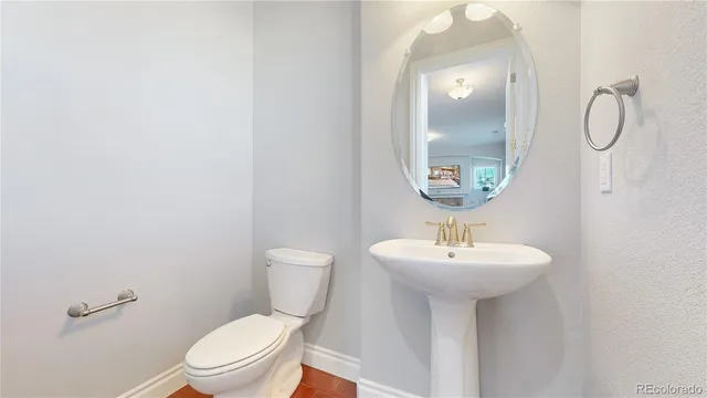 a bedroom with a bed lamp and a large window