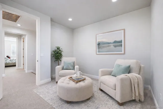 a bathroom with a granite countertop double vanity sink and mirror