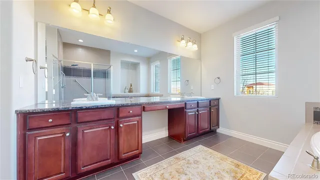 a bathroom with a tub and a sink