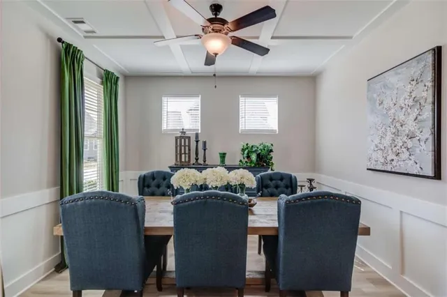 a dining room with furniture and window
