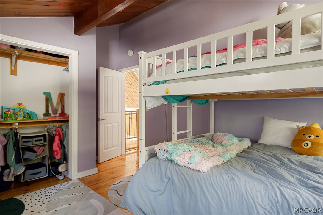 316 Pioneer Road Lake Arrowhead, CA 92352 - Photo 21 of 35 a bedroom with a bed and a dresser