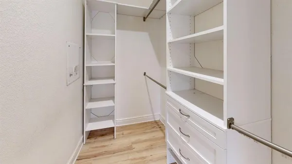 a view of an empty walk in closet