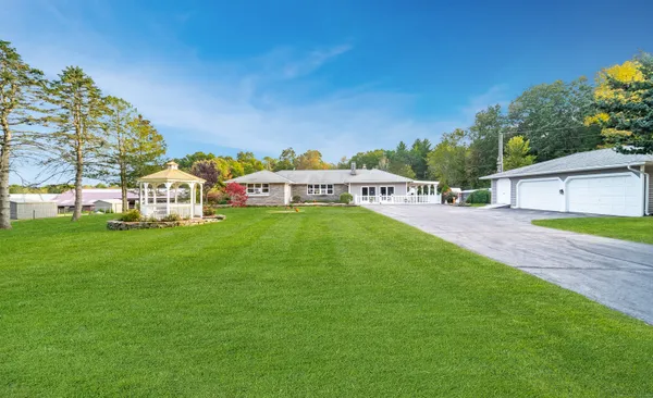 a view of a house with a yard