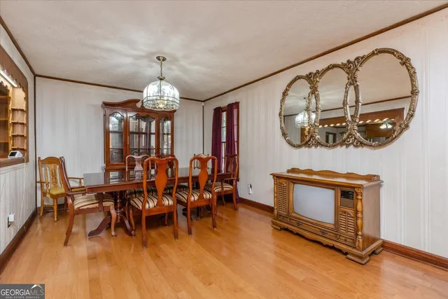 a living room with furniture fireplace and flat screen tv