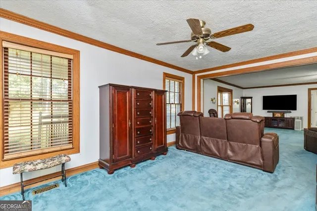 a bedroom with bed and window