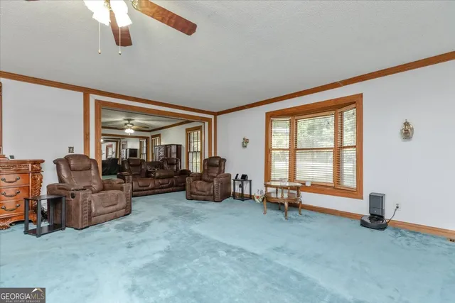 a view of walk in closet with clothes
