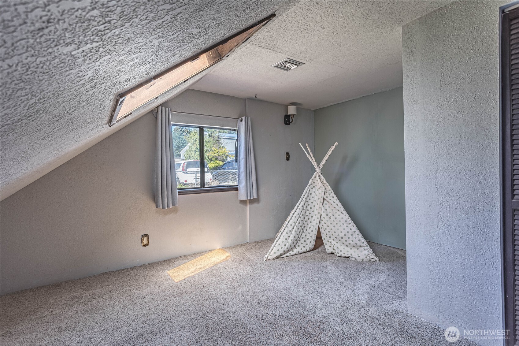 1314 Walnut Street Wenatchee, WA 98801 - Photo 16 of 40 a view of a livingroom with a staircase and white walls
