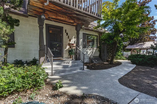 a front view of a house with garden