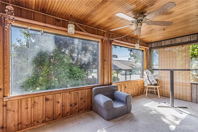 a view of a porch with furniture and a window