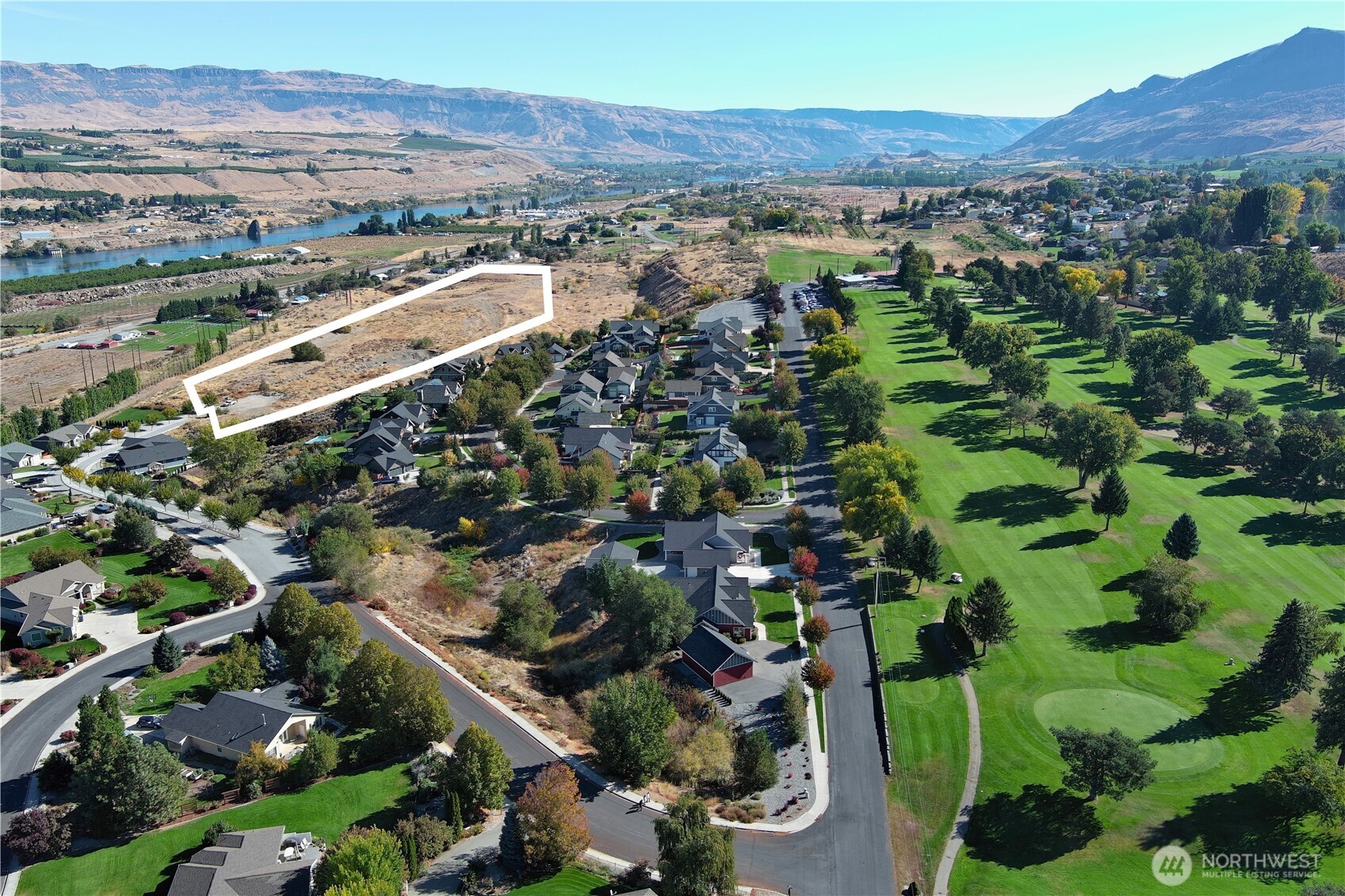 an aerial view of residential houses and outdoor space