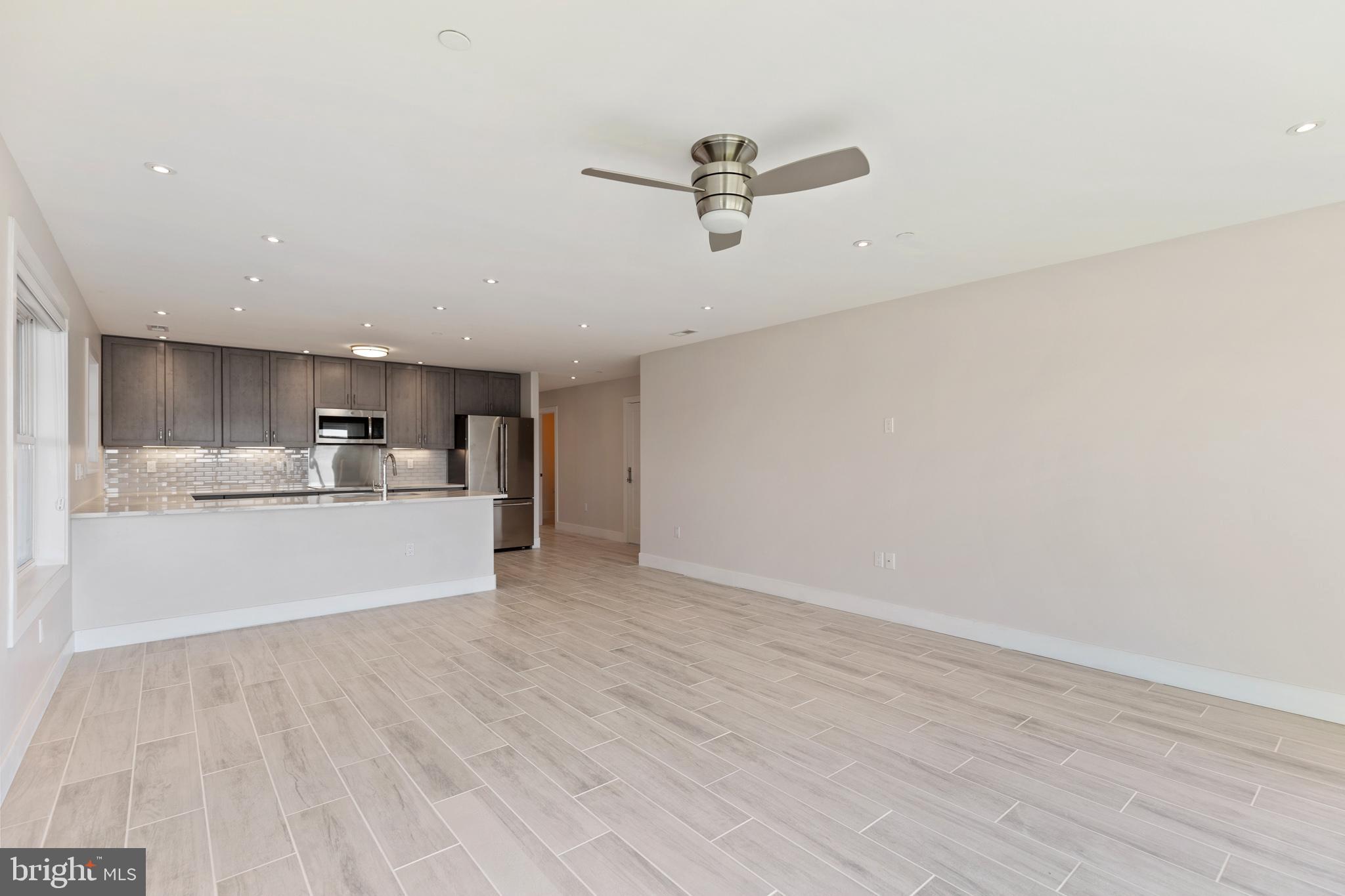 14732 Patuxent Avenue Solomons, MD 20688 - Photo 15 of 31 a view of a kitchen with a sink and cabinets