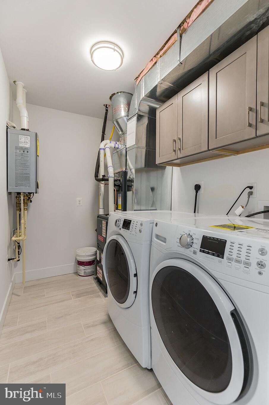 14732 Patuxent Avenue Solomons, MD 20688 - Photo 17 of 31 a utility room with dryer and washer