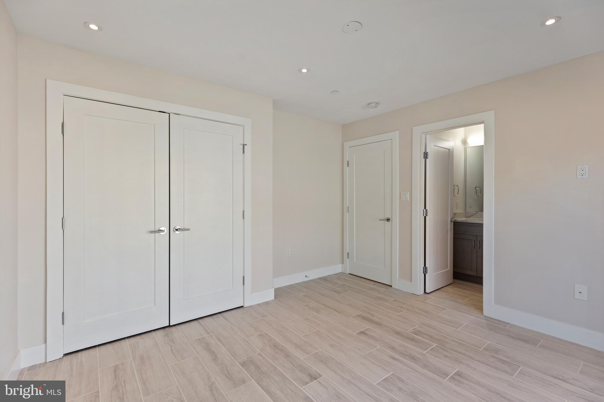 14732 Patuxent Avenue Solomons, MD 20688 - Photo 21 of 31 a view of an empty room with wooden floor