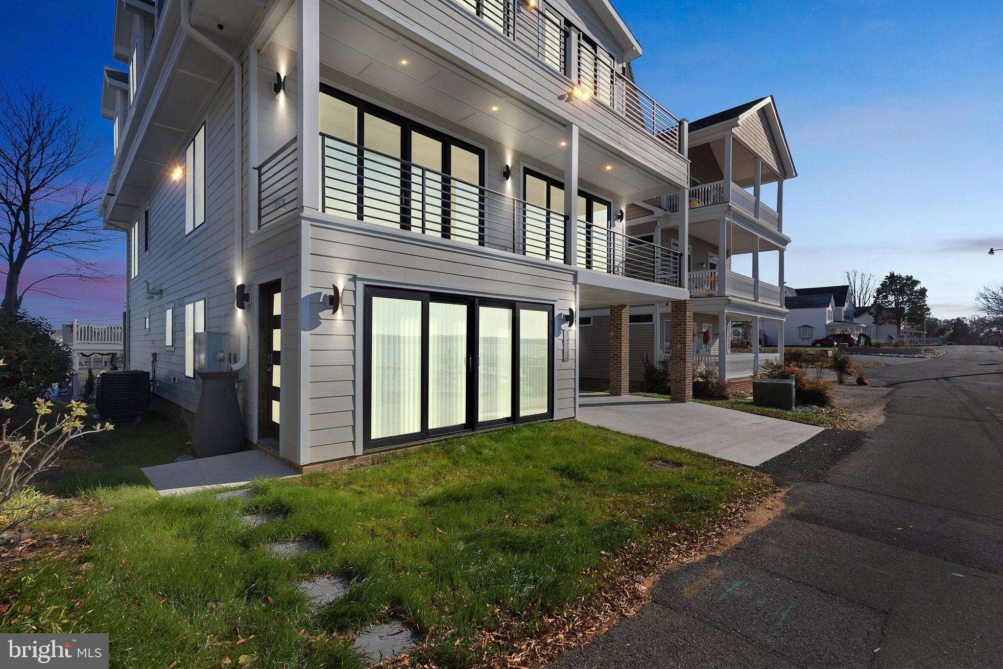 14732 Patuxent Avenue Solomons, MD 20688 - Photo 5 of 31 a view of a building with a yard