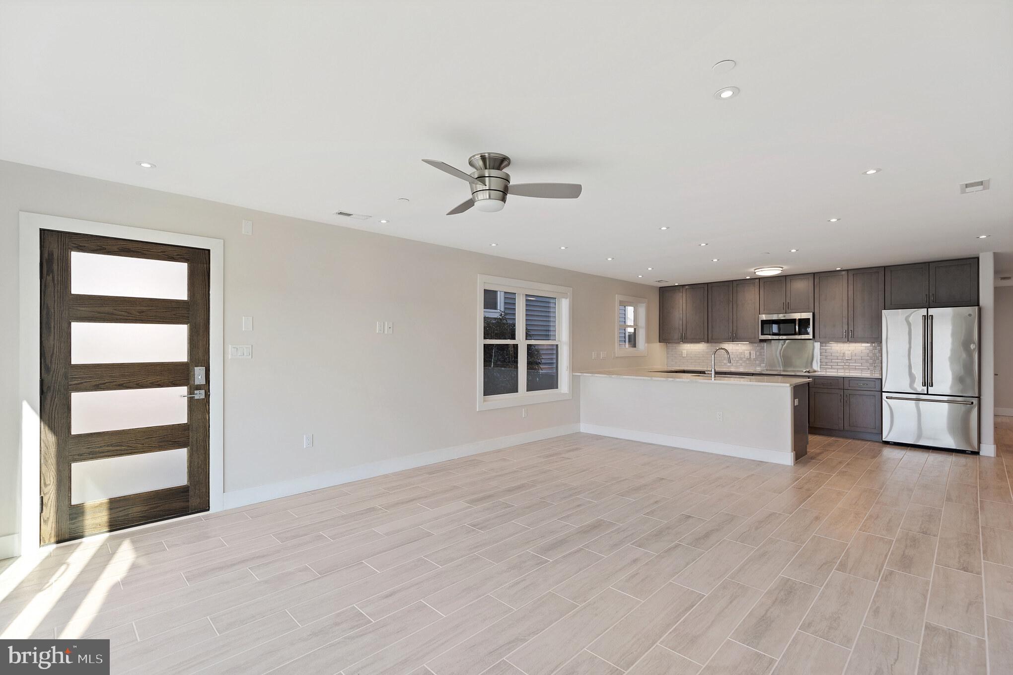 14732 Patuxent Avenue Solomons, MD 20688 - Photo 6 of 31 a view of a kitchen with microwave and cabinets