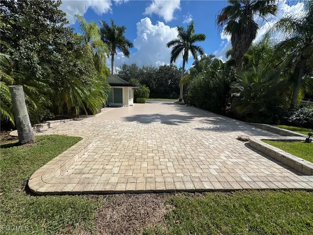 a view of a backyard of the house