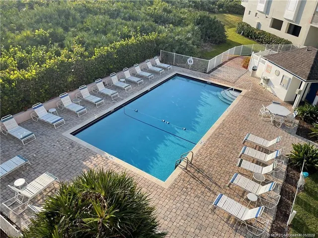an aerial view of a house with outdoor space