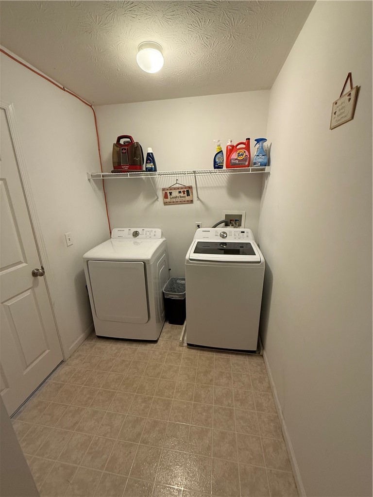 3159 Hance Road Macedon, NY 14502 - Photo 21 of 43 A functional utility space includes classic textured ceilings and practical tiled flooring.
