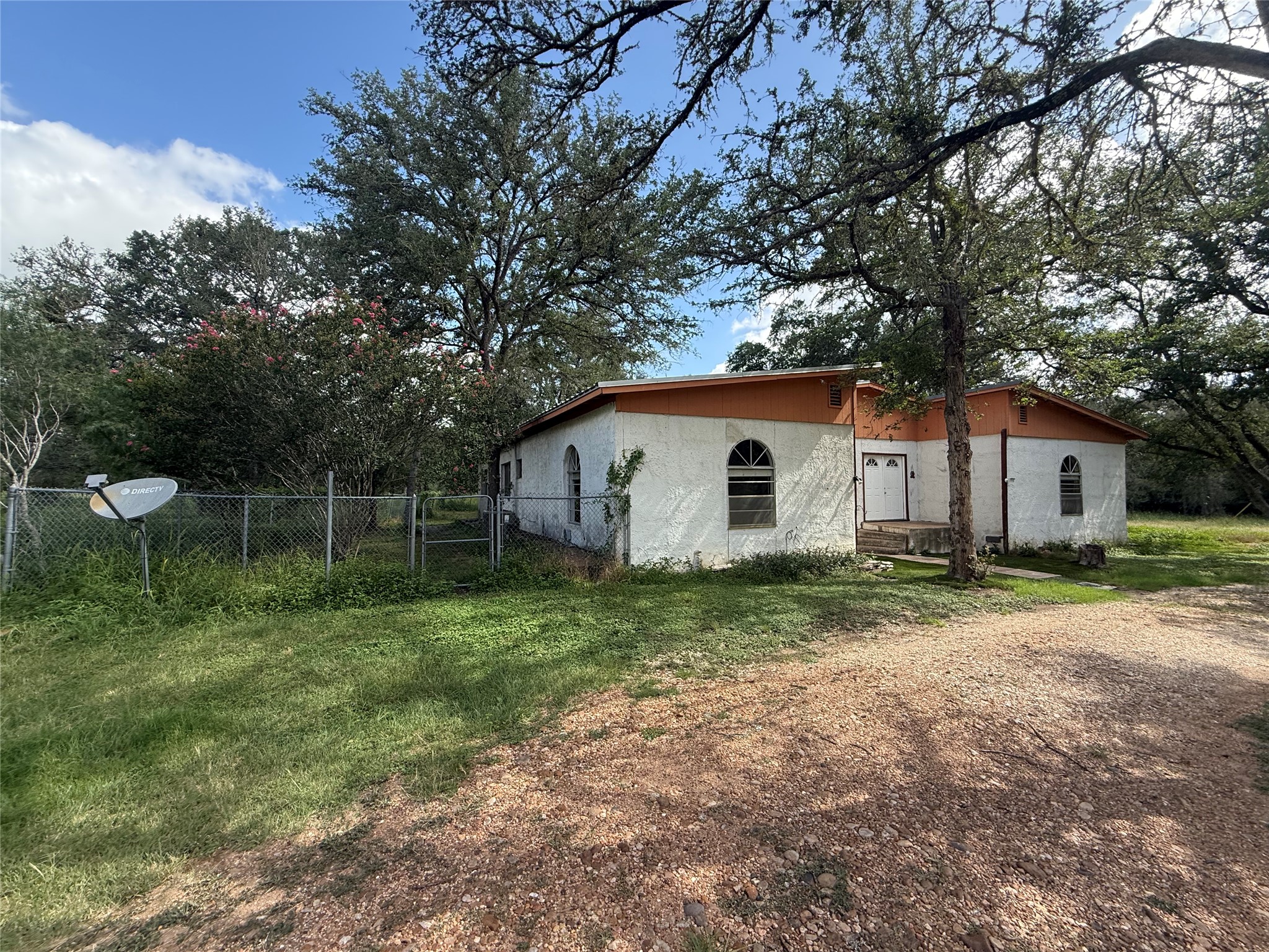 254 Lone Star Road Bastrop, TX 78602 - Photo 2 of 20 Plenty of room to enjoy the outdoors beneath mature shade trees.