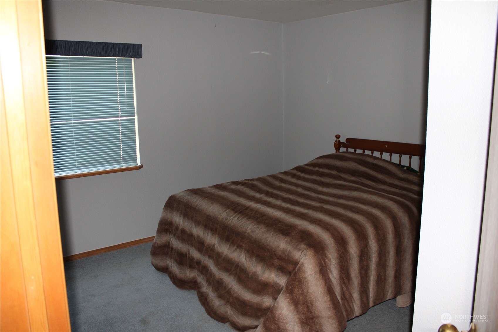 110 Bartroff Road Oroville, WA 98844 - Photo 15 of 38 a bedroom with a bed and a window
