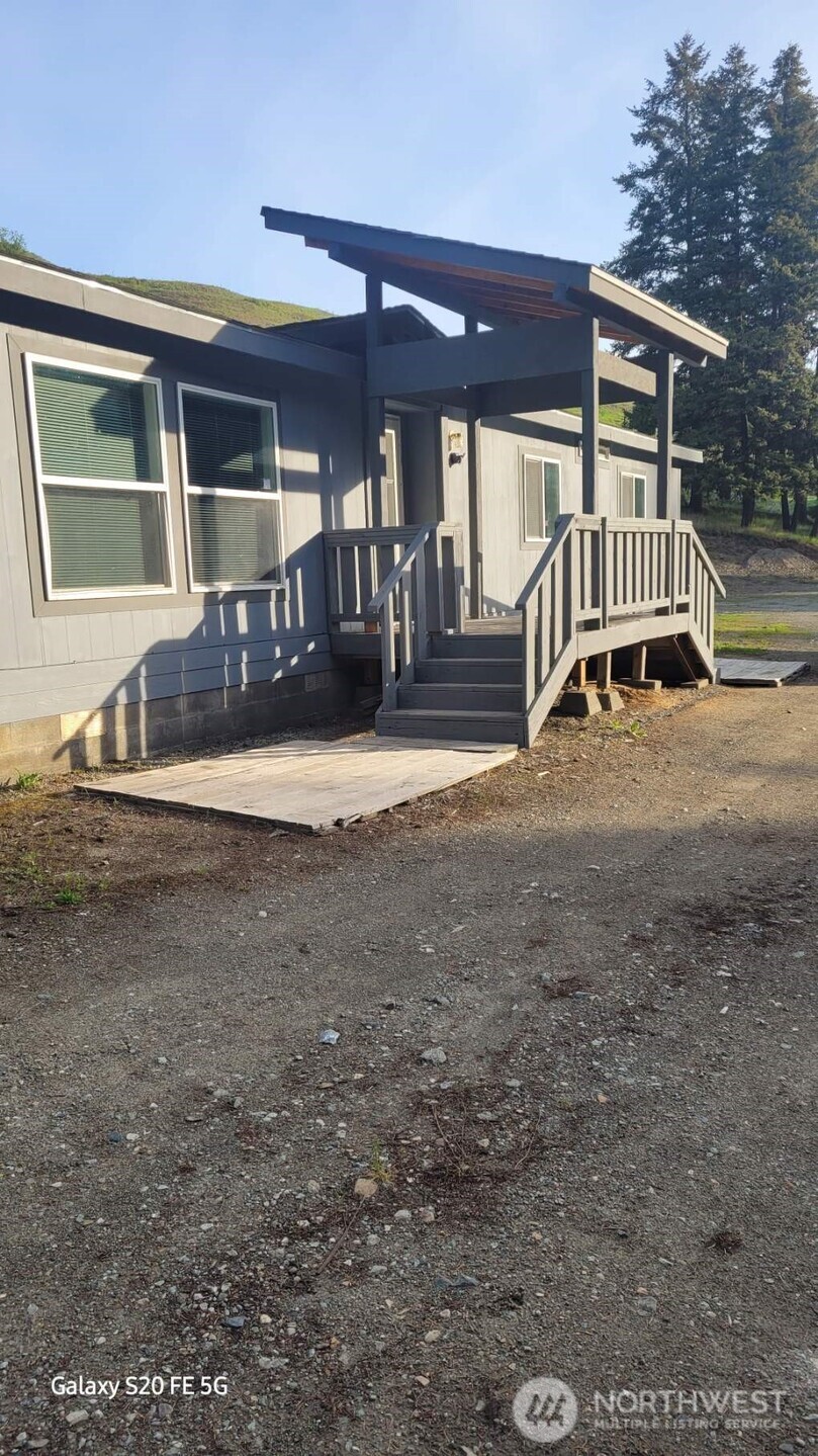 110 Bartroff Road Oroville, WA 98844 - Photo 2 of 38 a view of a house with a patio