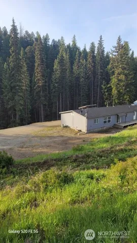 a swimming pool with trees in the background