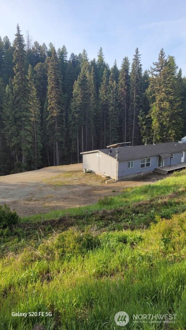 110 Bartroff Road Oroville, WA 98844 - Photo 4 of 38 a swimming pool with trees in the background