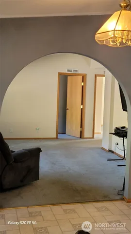 a view of an empty room and window