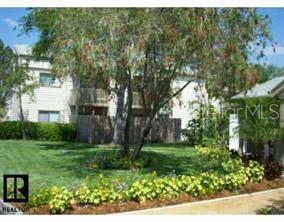 7298 Ulmerton Road, Unit 104 Largo, FL 33771 - Photo 1 of 1 a view of a house with a yard