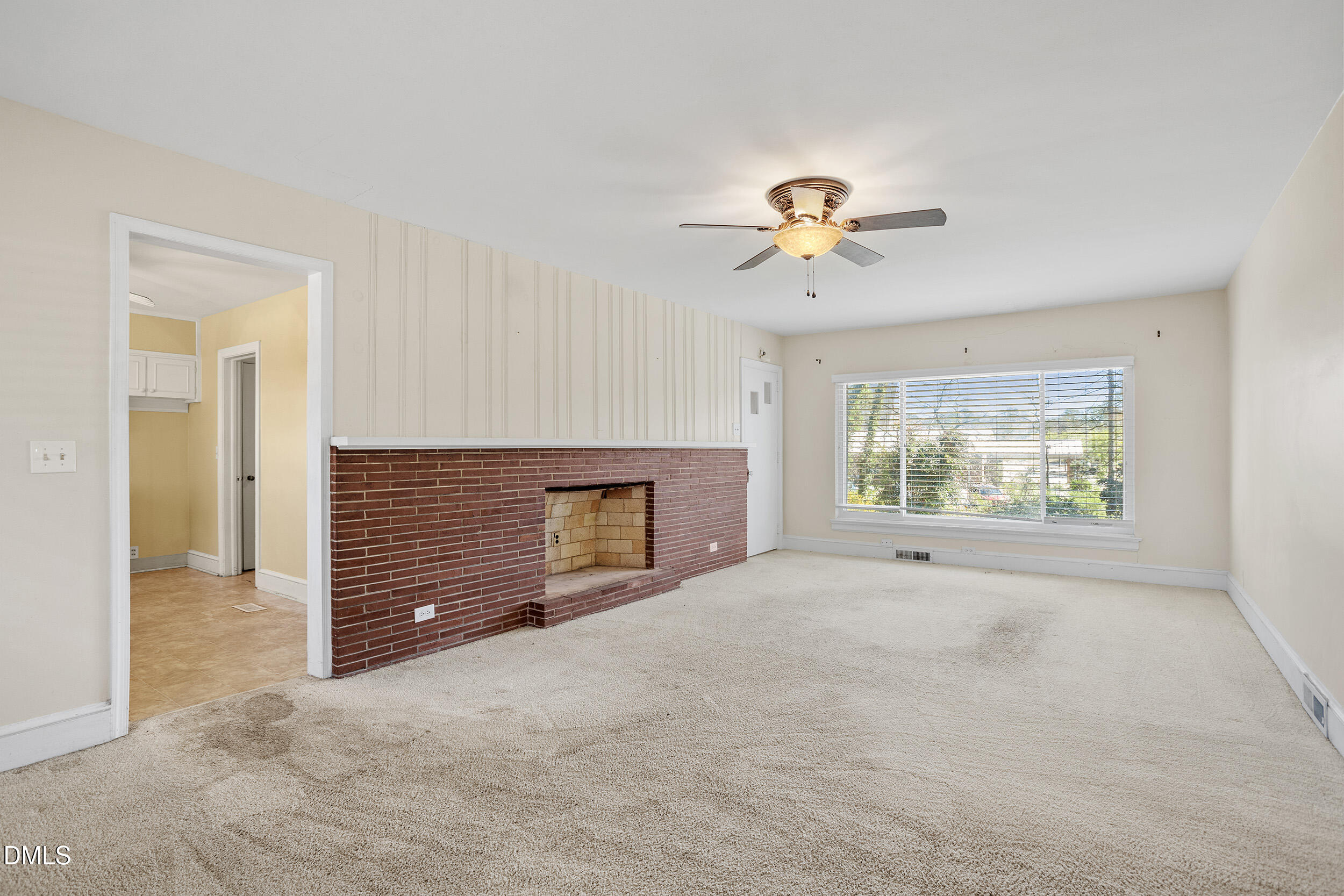 5011 Old Stage Road Raleigh, NC 27603 - Photo 9 of 29 an empty room with windows and fireplace
