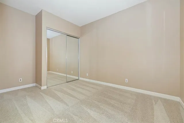 a spacious bathroom with a tub sink and mirror
