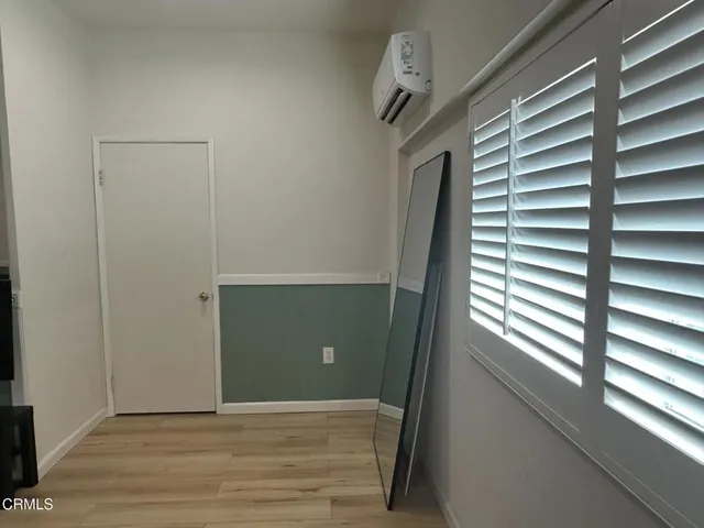 a view of a room that has a window in it