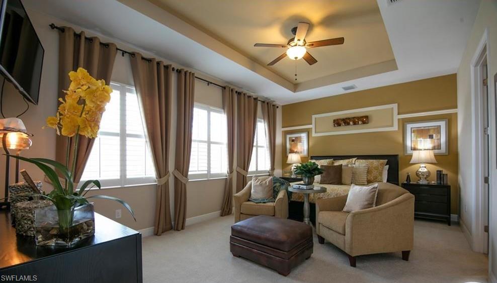 13644 Manchester Lane Naples, FL 34109 - Photo 14 of 18 a living room with furniture ceiling fan and a window