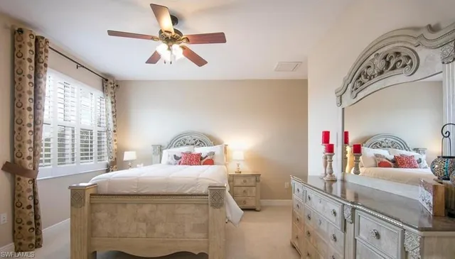 a bedroom with a bed and window