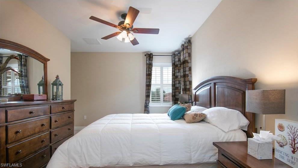13644 Manchester Lane Naples, FL 34109 - Photo 17 of 18 a bedroom with a bed and window