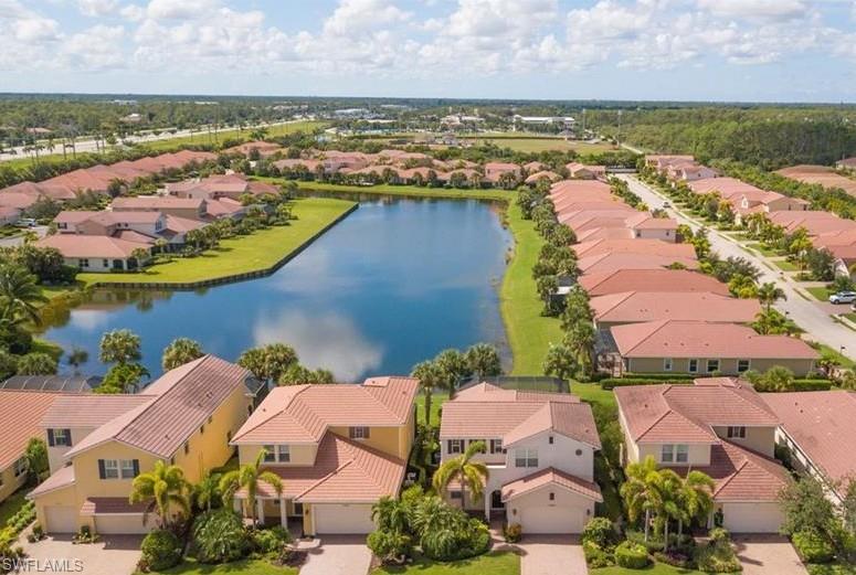 13644 Manchester Lane Naples, FL 34109 - Photo 5 of 18 an aerial view of residential houses with outdoor space and lake view