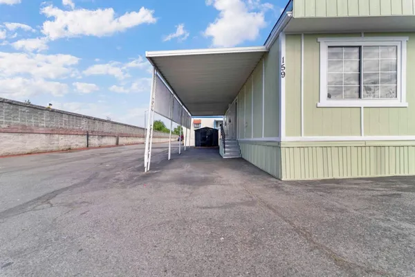 a view of an empty room with wooden fence