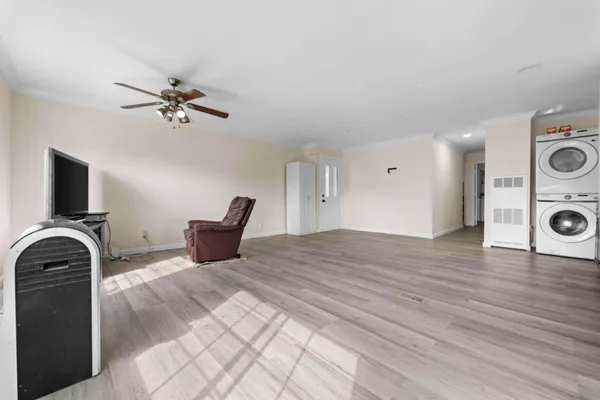 a bedroom with a bed and a chair