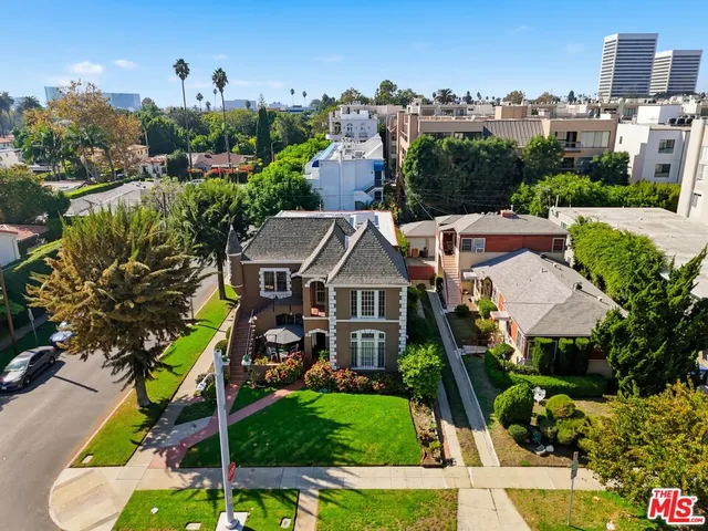 a front view of a house with outdoor seating and plants