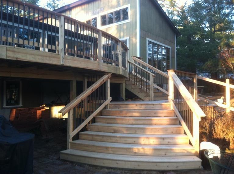 580 Lumbert Mill Road Centerville, MA 02632 - Photo 11 of 34 a view of staircase with lots of frames on wall and trees