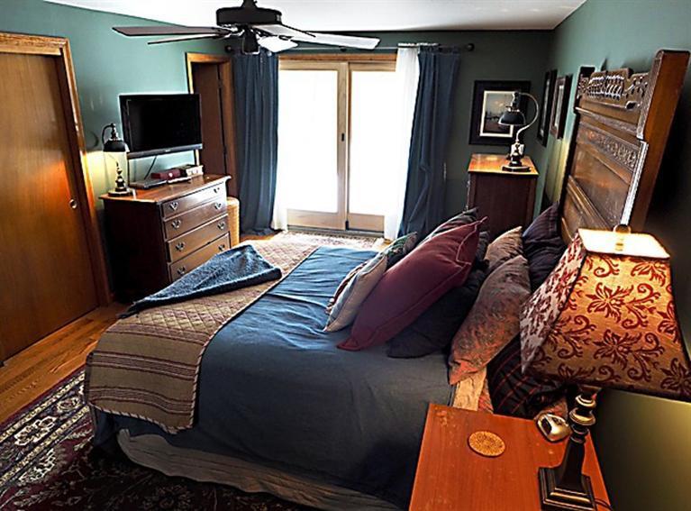 580 Lumbert Mill Road Centerville, MA 02632 - Photo 25 of 34 a bedroom with a bed and flat screen tv