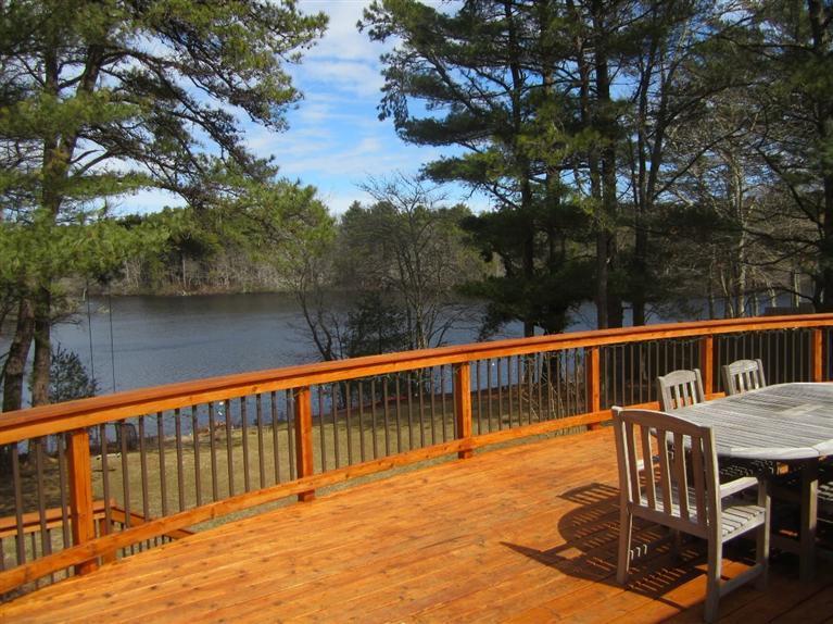 580 Lumbert Mill Road Centerville, MA 02632 - Photo 8 of 34 a view of balcony with wooden floor and lake view