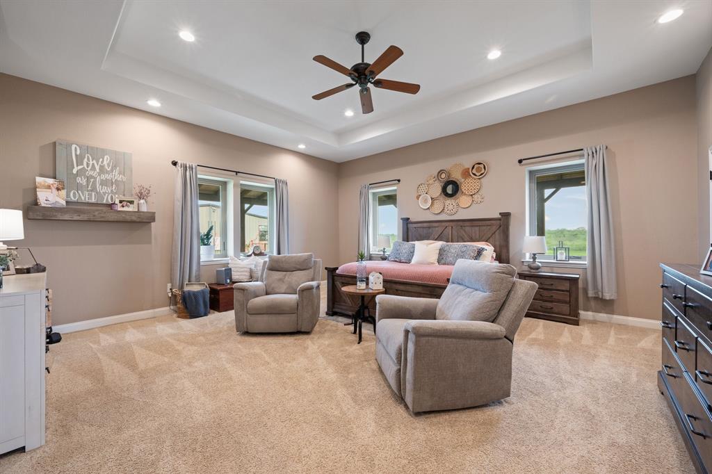 290 Barton Road Maypearl, TX 76064 - Photo 11 of 34 a living room with furniture ceiling fan and a window