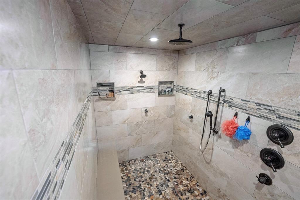 290 Barton Road Maypearl, TX 76064 - Photo 16 of 32 a bathroom with a tub and shower