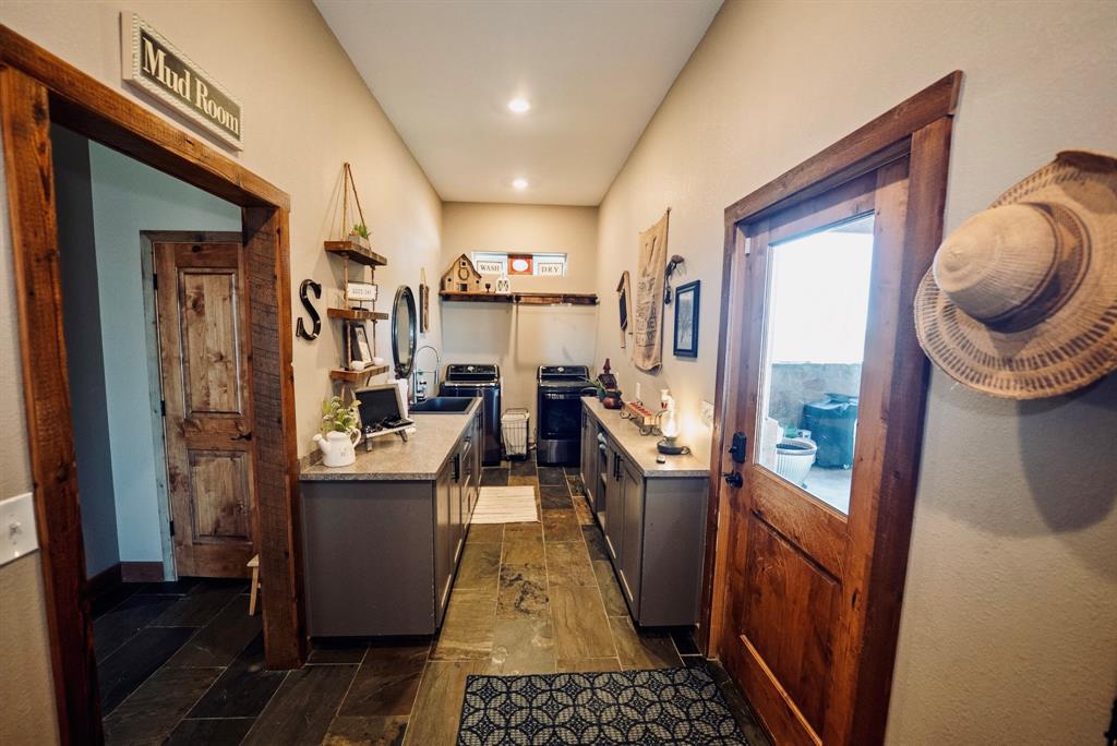 290 Barton Road Maypearl, TX 76064 - Photo 20 of 32 a kitchen with stainless steel appliances granite countertop a refrigerator a stove and a sink